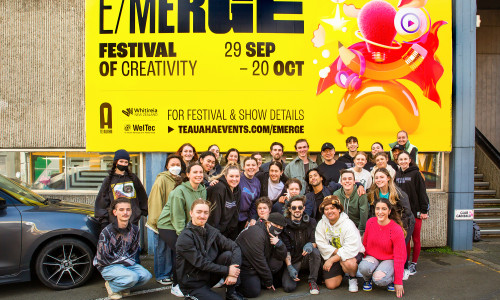 Whitireia and WelTec students with EMERGE billboard